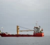 a vessel at the strait of hormuz off the coast of oman s musandam province april 12 2026 photo reuters