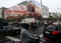 people ride motorcycles near a billboard featuring an image of iran s new supreme leader mojtaba khamenei amid a ceasefire between u s and iran in tehran iran april 20 2026 photo reuters