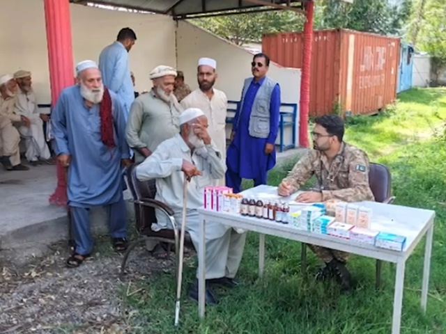 Free medicines being distributed during a medical camp organized by the army. Photo: Express