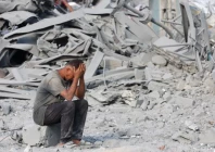 a palestinian man reacts to the destruction after an israeli strike on the sheikh radwan health centre run by the united nations relief and works agency for palestine refugees unrwa in the north of gaza city on august 6 2025 photo afp