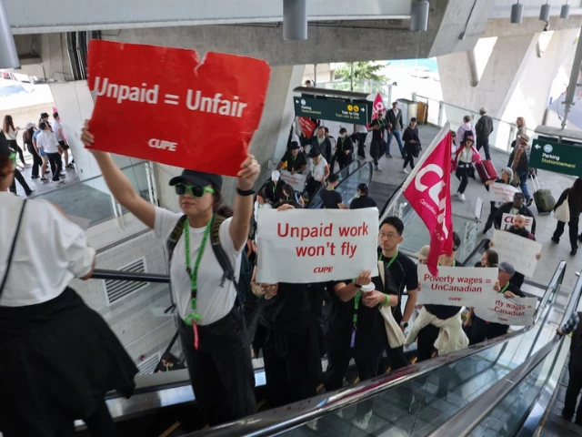 demonstrators display placards while riding an escalator as air canada flight attendants said they will remain on strike and challenge a return to work order they called unconstitutional defying a government decision to force them back to their duties at vancouver international airport in richmond british columbia canada august 17 2025 reuters