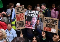 demonstrators gather during a protest against israeli president isaac herzog s visit to australia at flinders street station in melbourne australia february 9 2026 source reuters