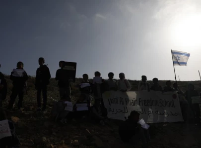 armed israeli occupier storms palestinian school chases students in occupied west bank