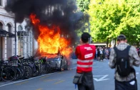 a tesla car burns during a protest against the upcoming g7 summit in evian les bains in france in geneva switzerland june 14 2026 photo reuters