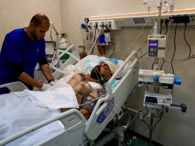 hamdi al najjar a wounded palestinian father and doctor who according to medics lost nine of his children in an israeli strike on friday lies in a hospital bed in the intensive care unit at nasser hospital after being injured in the same strike in khan younis in the southern gaza strip may 25 2025 photo reuter hamdi al najjar a wounded palestinian father and doctor who according to medics lost nine of his children in an israeli strike on friday lies in a hospital bed in the intensive care unit at nasser hospital after being injured in the same strike in khan younis in the southern gaza strip may 25 2025 photo reuter