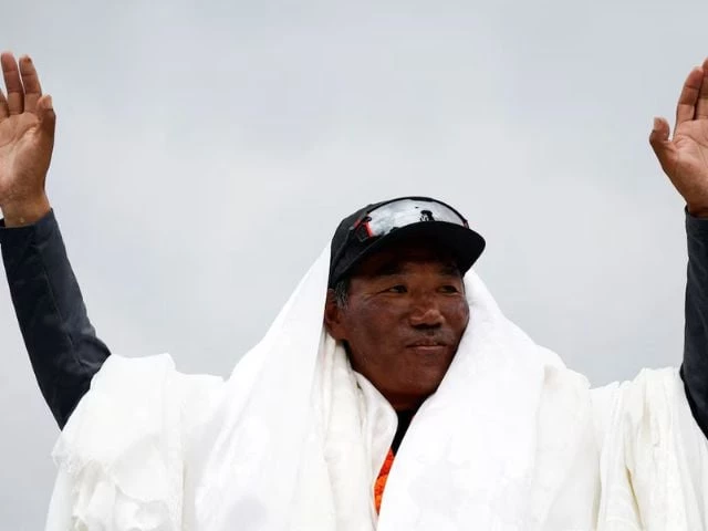 kami rita sherpa 53 a nepali mountaineer waves towards the media personnel upon his arrival after climbing mount everest for the 28th time creating a new record for the most summits of the world s highest mountain in kathmandu nepal may 25 2023 photo reuters