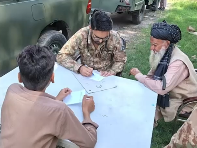 Residents receive free check-ups and medicines at an army-run medical camp. Photo: Express