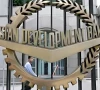 a worker walks past inside the asian development bank adb headquarters in manila photo reuters file