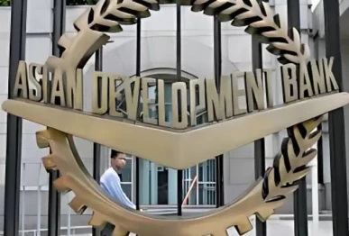 a worker walks past inside the asian development bank adb headquarters in manila photo reuters file