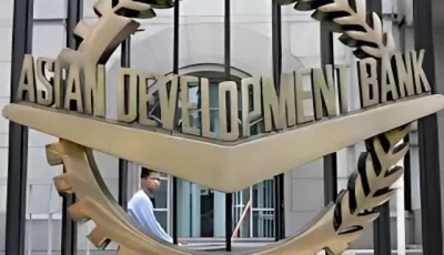 a worker walks past inside the asian development bank adb headquarters in manila june 17 2009 photo reuters