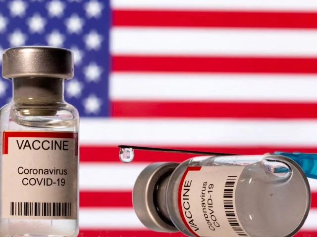vials labelled vaccine coronavirus covid 19 and a syringe are seen in front of a displayed u s flag in this illustration taken december 11 2021 photo reuter vials labelled vaccine coronavirus covid 19 and a syringe are seen in front of a displayed u s flag in this illustration taken december 11 2021 photo reuter
