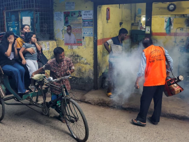 a city corporation worker uses a fumigator to control the spread of mosquitoes as the number of dengue infected patients increases in dhaka bangladesh october 14 2024 photo reuters