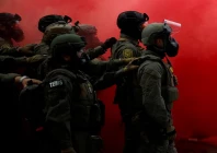 law enforcement officers stand amid smoke from a smoke grenade released to disperse demonstrators in front of the us immigration and customs enforcement ice headquarters in portland oregon u s october 4 2025 photo reuters