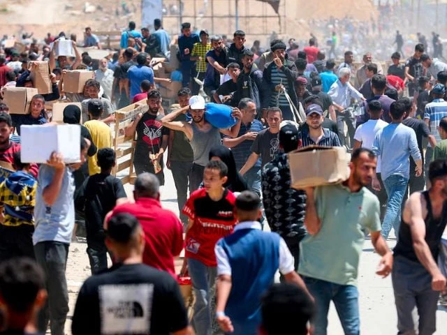 palestinians carry aid supplies which they received from the u s backed gaza humanitarian foundation in the central gaza strip may 29 2025 photo reuters palestinians carry aid supplies which they received from the u s backed gaza humanitarian foundation in the central gaza strip may 29 2025 photo reuters