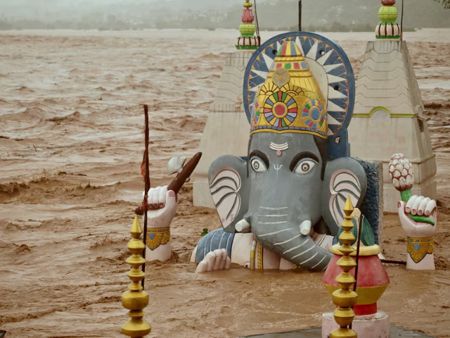Water from the overflowing Tawi River floods a temple of the Hindu elephant god Ganesh, the deity of prosperity, following heavy rain in Indian Illegally Occupied Jammu and Kashmir,  August 26, 2025. Photo: Reuters