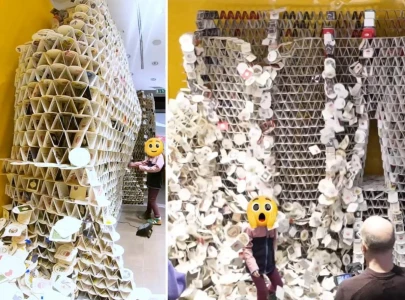 girl accidentally topples 63 000 beer coaster tower built for world record