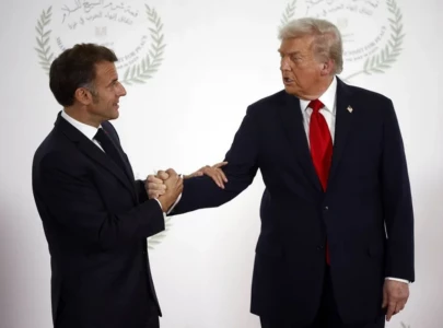 trump s intense 26 second handshake with macron turns into viral tug of war spectacle trump s intense 26 second handshake with macron turns into viral tug of war spectacle