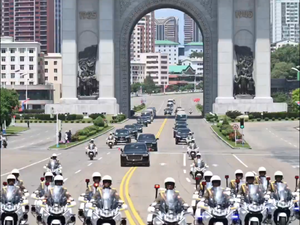 Flags, gun salute greet China's Xi on arrival in North Korea for summit