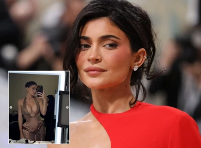 kylie jenner sparks surgery speculation after paris fashion week appearance in plunging gold dress