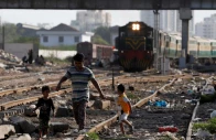 siblings walk along a railway tracks at a slum area in karachi pakistan july 9 2020 photo reuters