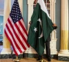 a state department contractor adjusts a pakistan national flag before a meeting between us secretary of state john kerry and pakistan s interior minister chaudhry nisar ali khan on the sidelines of the white house summit on countering violent extremism at the state department in washington february 19 2015 photo reuters