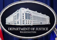 a us justice department logo or seal showing justice department headquarters known as main justice is seen behind the podium in the department s headquarters briefing room in washington january 24 2023 photo reuters