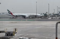 an emirates airplane at dubai international airport amid the u s  israeli conflict with iran in dubai united arab emirates march 8 2026 picture taken by phone photo reuters
