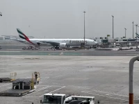 an emirates airplane at dubai international airport amid the u s  israeli conflict with iran in dubai united arab emirates march 8 2026 picture taken by phone photo reuters