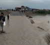 the busy national highway from zhob to dera ismail khan experienced a flood late sunday night stranding hundereds of passengers photo express