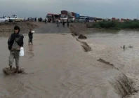 the busy national highway from zhob to dera ismail khan experienced a flood late sunday night stranding hundereds of passengers photo express
