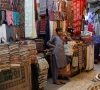 a shopkeeper stands outside his shop while waiting for customers ahead of eid al fitr celebrations in karachi pakistan april 19 2023 photo reuters a shopkeeper stands outside his shop while waiting for customers ahead of eid al fitr celebrations in karachi pakistan april 19 2023 photo reuters