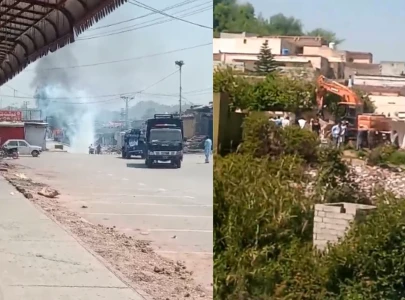 two vehicles torched as cda anti encroachment drive sparks protest in capital
