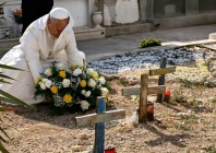 the pope lay a wreath of flowers on the unmarked graves of shipwreck victims at a cemetery on lampedusa island photo afp
