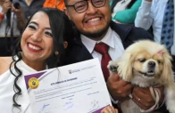 diana tupiza and andres alquinga pose with their dog luna who served as a witness at their civil wedding photo afp
