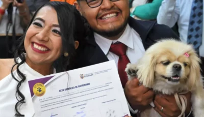 diana tupiza and andres alquinga pose with their dog luna who served as a witness at their civil wedding photo afp