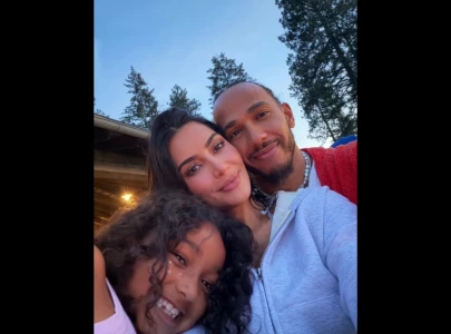 kim kardashian gives lewis hamilton a major place in her family vacation photos