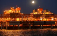 the full moon rises in the background over the infrastructure on d island the main processing hub at the kashagan offshore oil field in the caspian sea in western kazakhstan august 21 2013 photo reuters