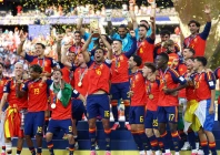 spain s rodri lifts the world cup trophy alongside teammates as they celebrate winning the world cup photo reuters