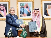 deputy prime minister and foreign minister ishaq dar and saudi foreign minister prince faisal bin farhan al saud sign an agreement abolishing visa requirements for holders of diplomatic and official special passports on the sidelines of the un general assembly in new york photo fo