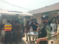 rescue officials shift the bodies of two fbr officials and two civilians killed in a firing incident in dera ismail khan to dhq hospital on october 6 2026 photo express
