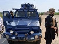 police personnel stand guard in bannu following an operation in which wanted commander zainullah alias salar was killed on saturday photo express