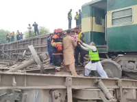 rescue workers evacuate passengers from the derailed rahman baba express near sher shah close to multan after 14 coaches of the karachi to peshawar train went off the tracks on tuesday photo express