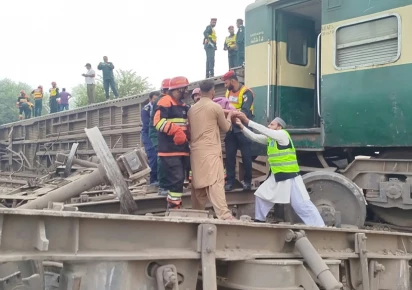 rescue workers evacuate passengers from the derailed rahman baba express near sher shah close to multan after 14 coaches of the karachi to peshawar train went off the tracks on tuesday photo express