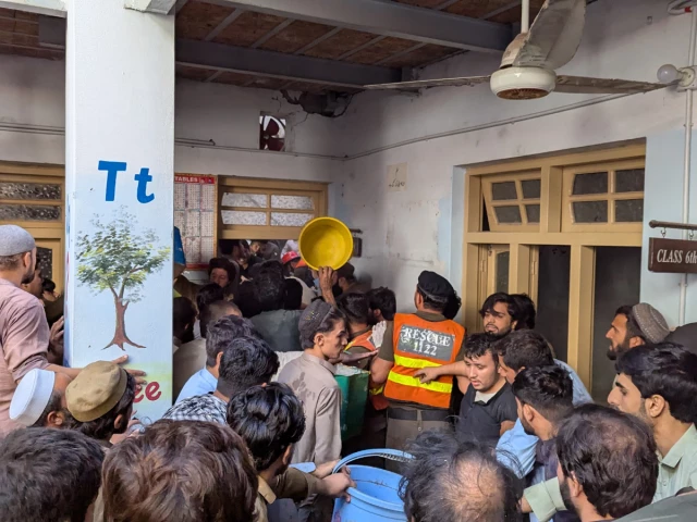 parents rush to rescue children trapped under the rubble after the roof of al khair school system collapsed in peshawar s dir colony on thursday photo express parents rush to rescue children trapped under the rubble after the roof of al khair school system collapsed in peshawar s dir colony on thursday photo express