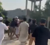 a screengrab from a video purportedly showing police taking pti mna maulana nasim ali shah away in ghoriwala bannu on monday