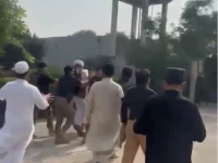 a screengrab from a video purportedly showing police taking pti mna maulana nasim ali shah away in ghoriwala bannu on monday