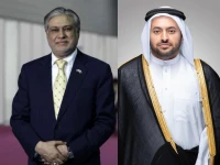 deputy prime minister and foreign minister ishaq dar l qatari minister of state for foreign affairs mohammad bin abdulaziz al khulaifi r