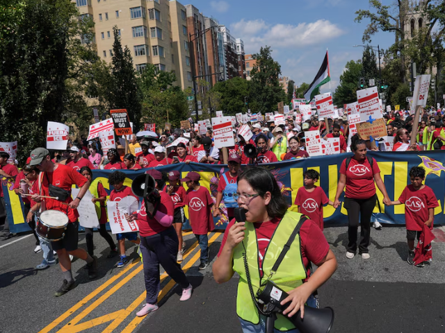Demonstrators attend the 