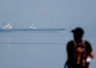a tourist watches the mt desert kite oil tanker carrying russian oil at narara marine national park in the arabian sea gujarat india march 11 2026 photo reuters