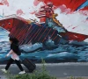 an iranian woman walks next to a mural on a street in tehran iran may 11 2026 photo reuters an iranian woman walks next to a mural on a street in tehran iran may 11 2026 photo reuters